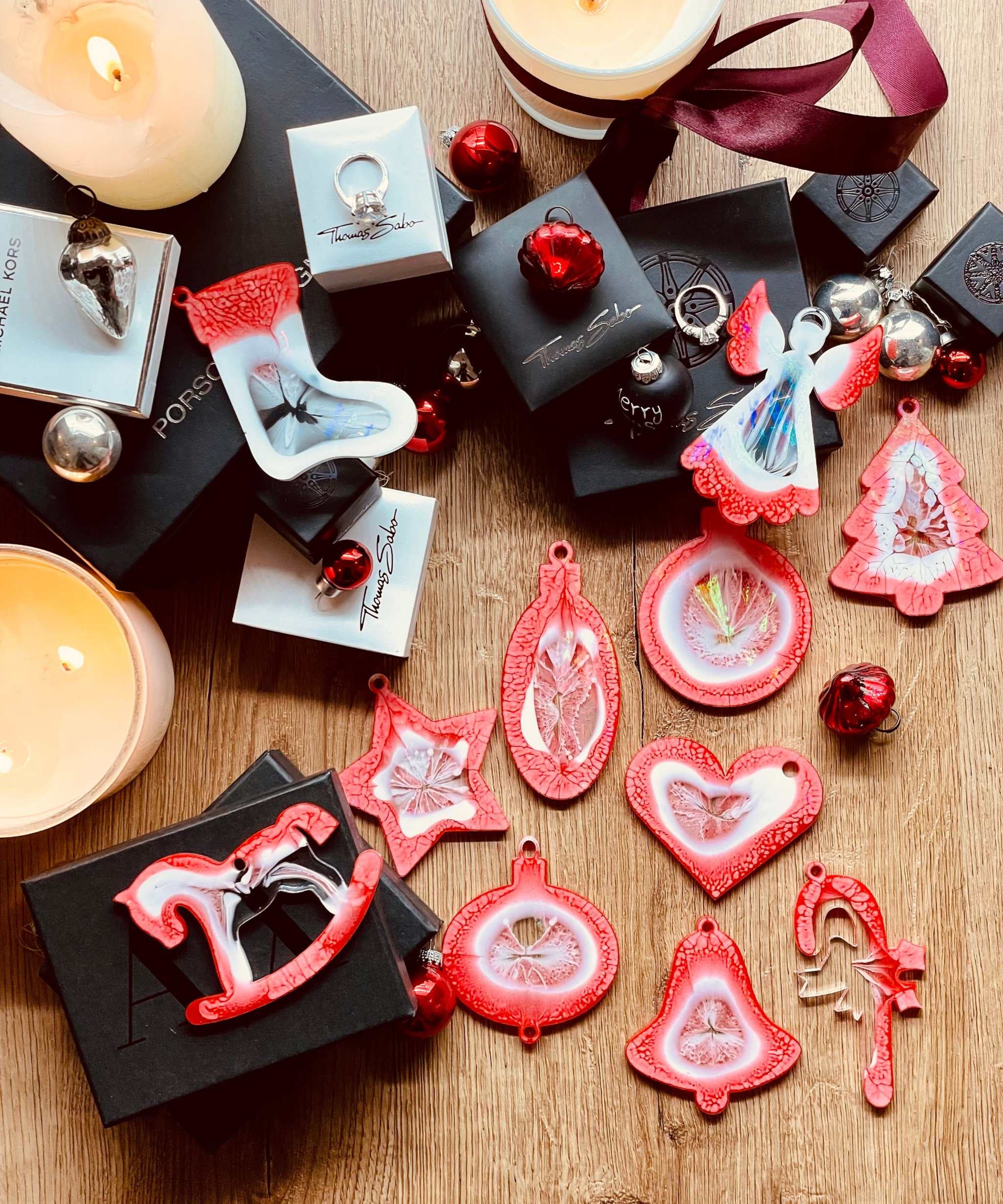 Red and white resin Christmas tree ornaments with holographic surface in a 10-piece handmade set.