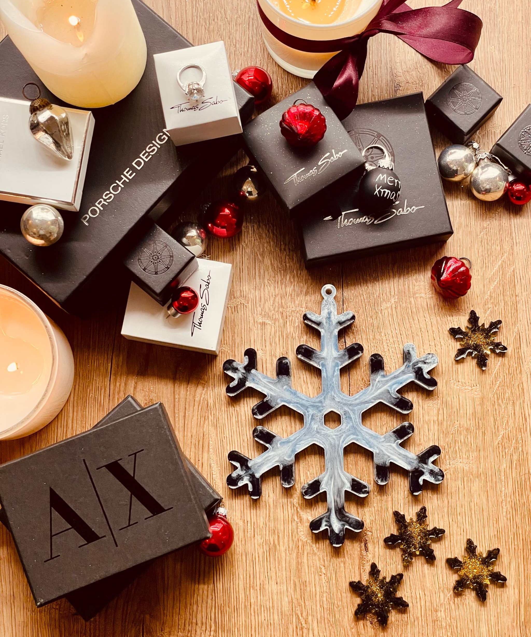 Handmade blue, white, and gold resin Christmas tree ornament.