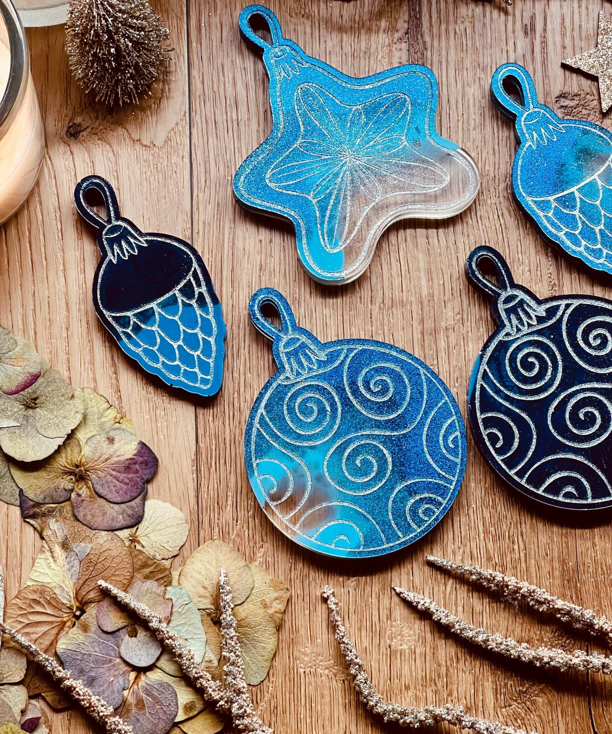 Handmade blue resin Christmas tree ornaments with silver accents, set of five.