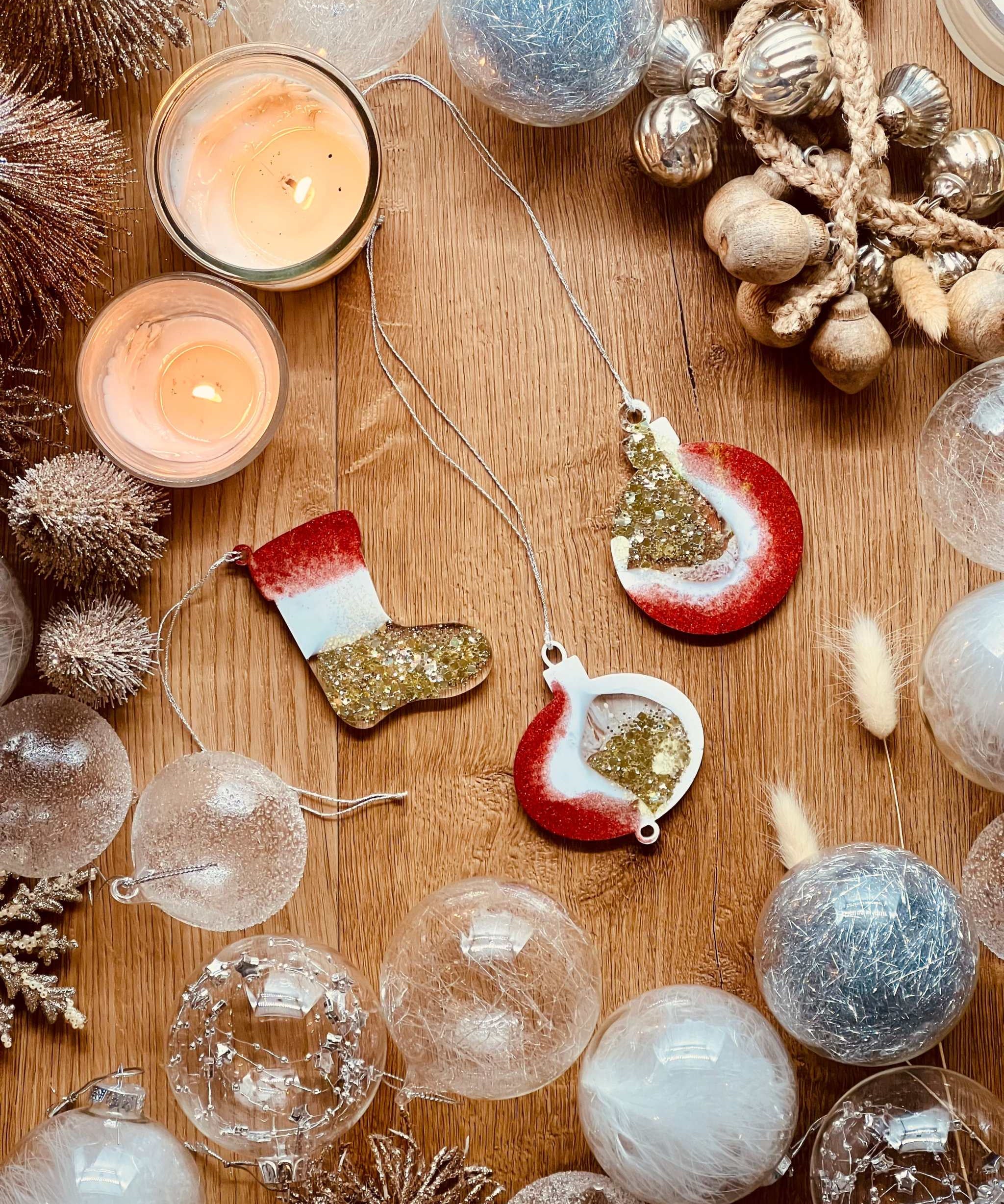 Handmade resin Christmas tree ornaments in red, gold, and white with holographic surface, set of three.