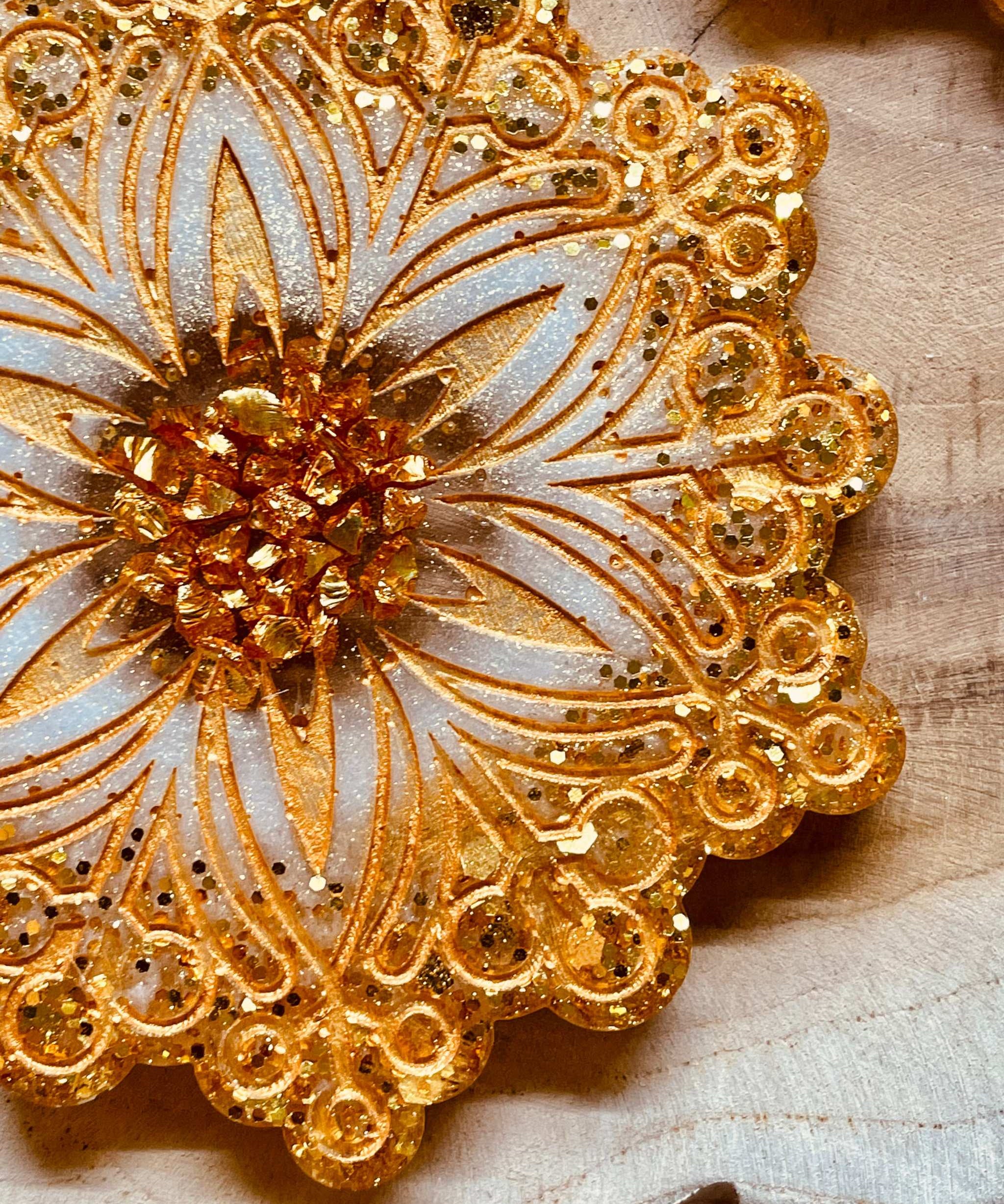 Handmade gold and white resin coasters for Christmas decor.
