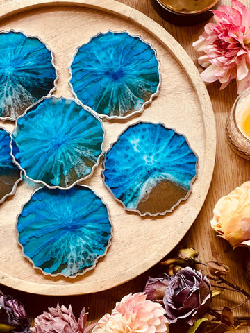 6 resin coasters in blue with silver in ocean design