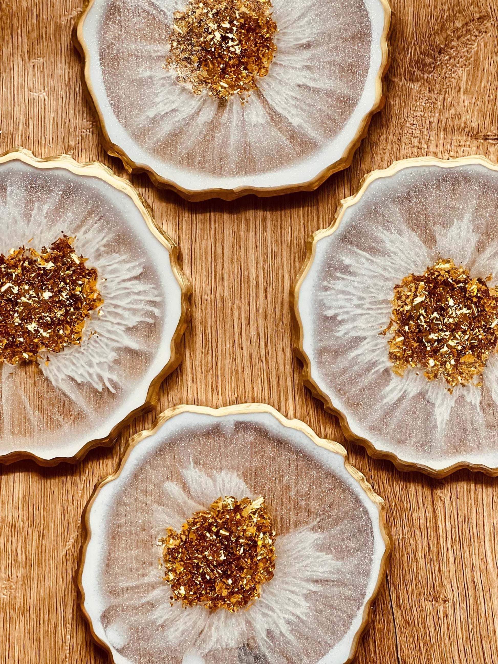Handmade white and gold resin coasters set of four, unique design.