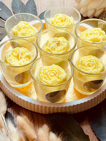 scented candle in glass with flower highlight