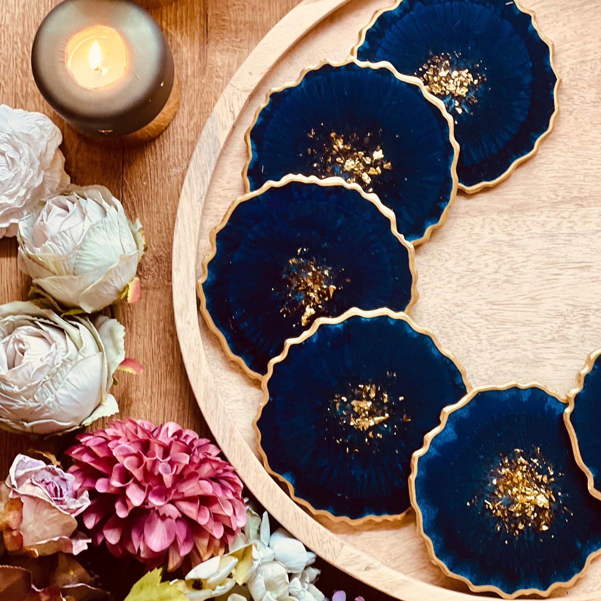 6 resin coasters in blue with gold