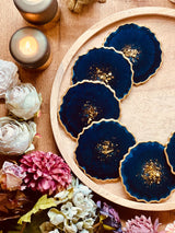 6 resin coasters in blue with gold