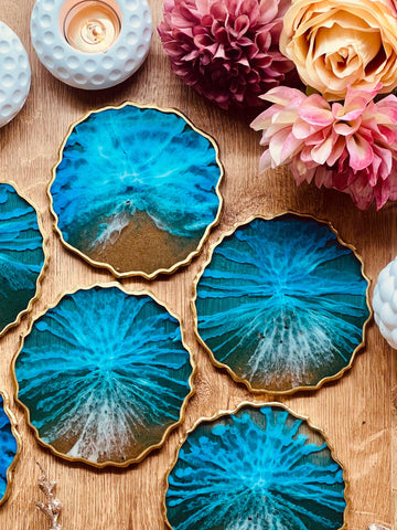 6 resin coasters in blue with gold in ocean design