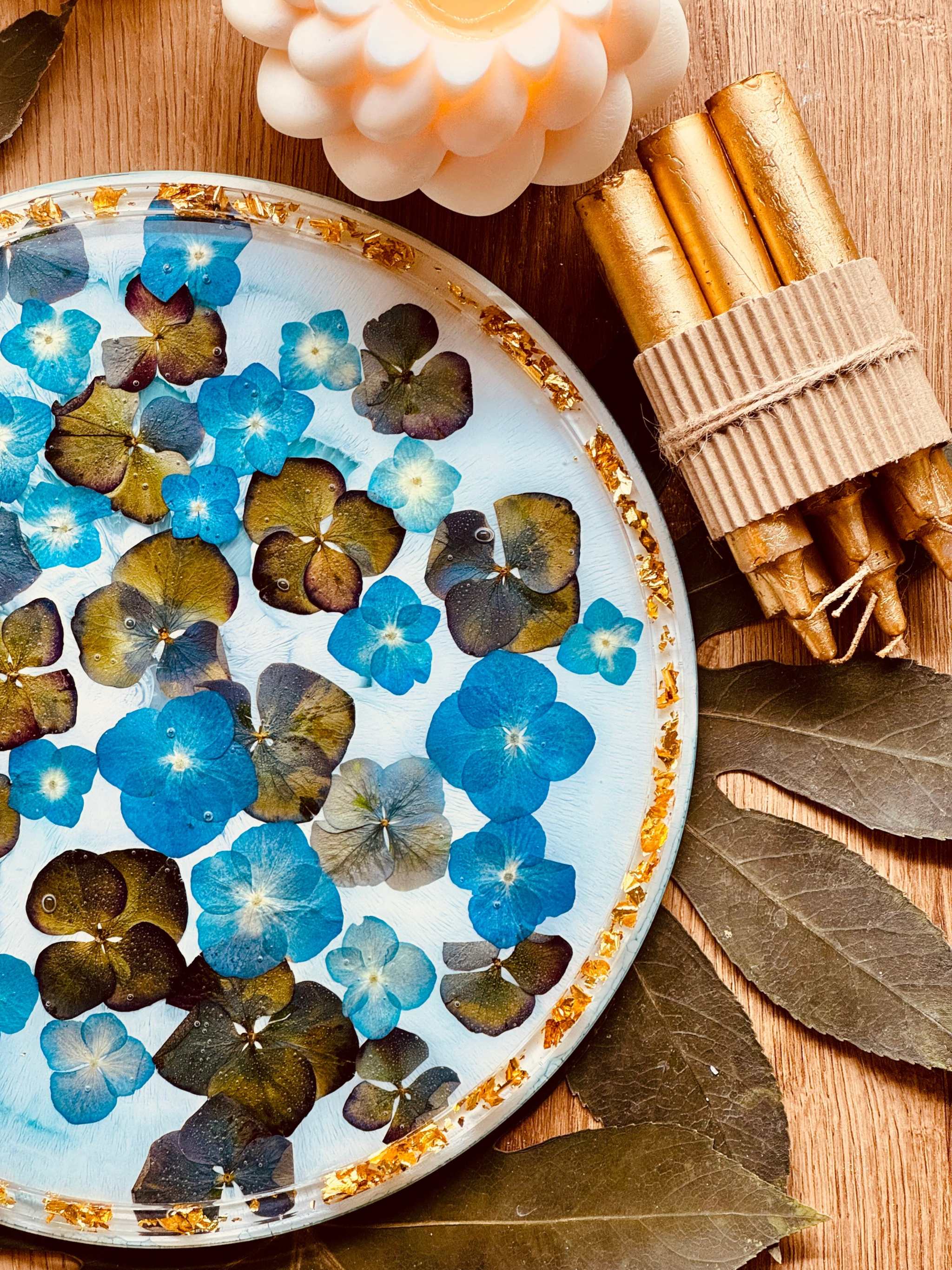 Handmade resin tray with flowers and gold details.
