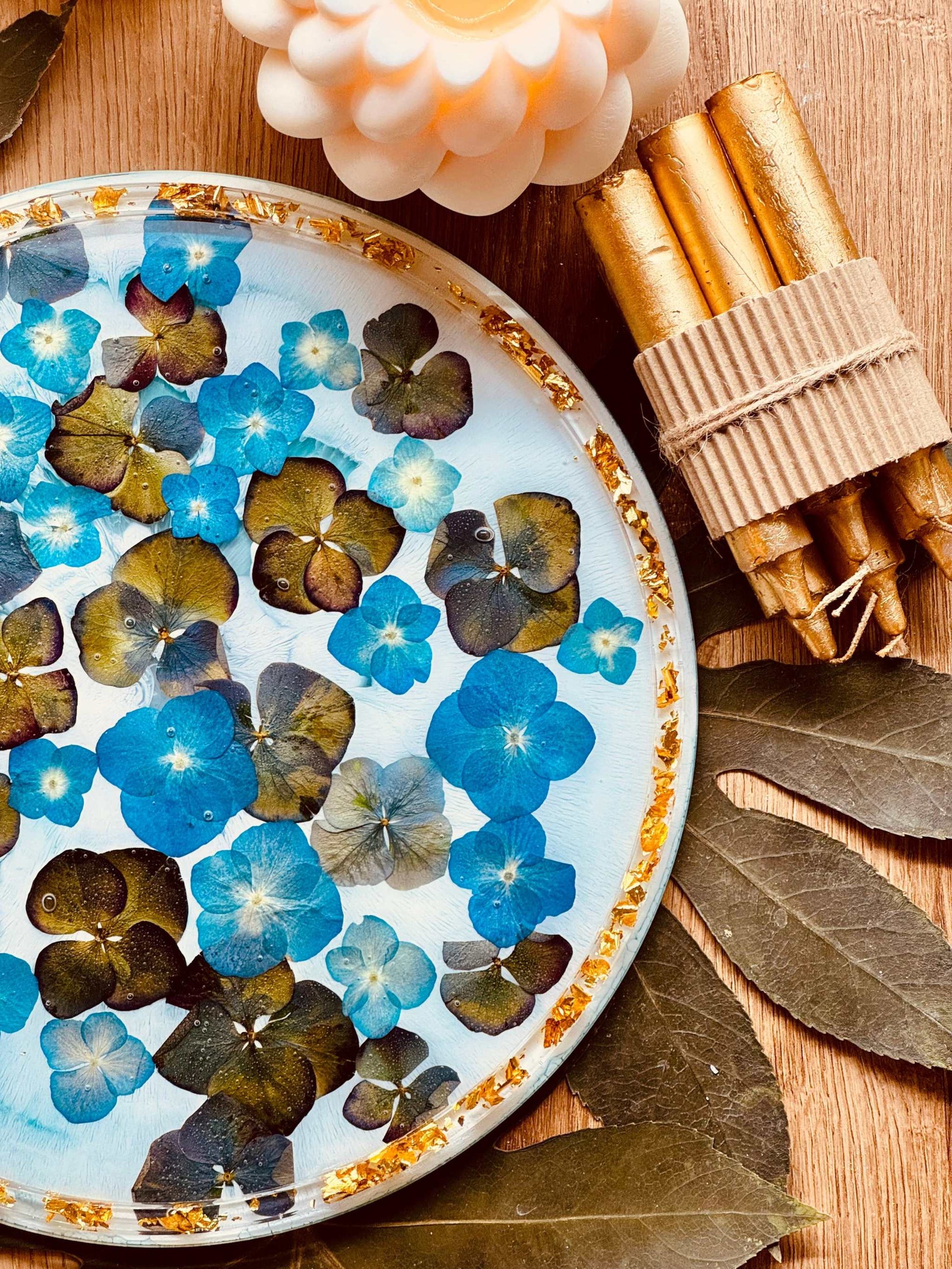 Handmade resin tray with flowers and gold details.
