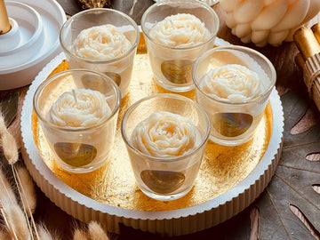 scented candle in glass with flower highlight