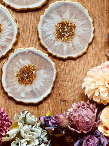 4 glamorous resin coasters in white with gold