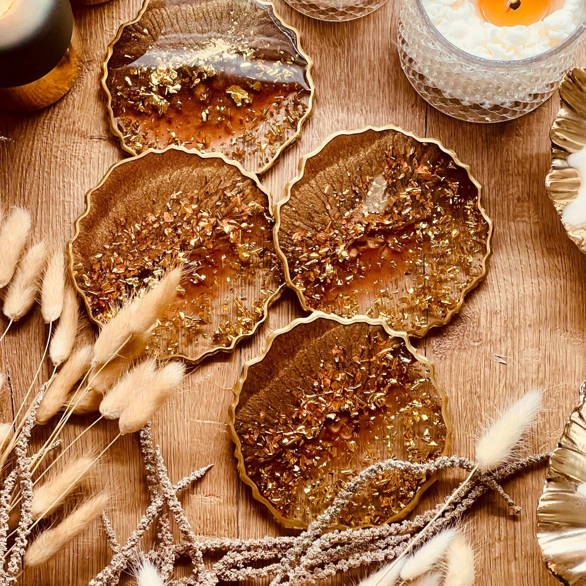 4 resin coasters in brown with gold