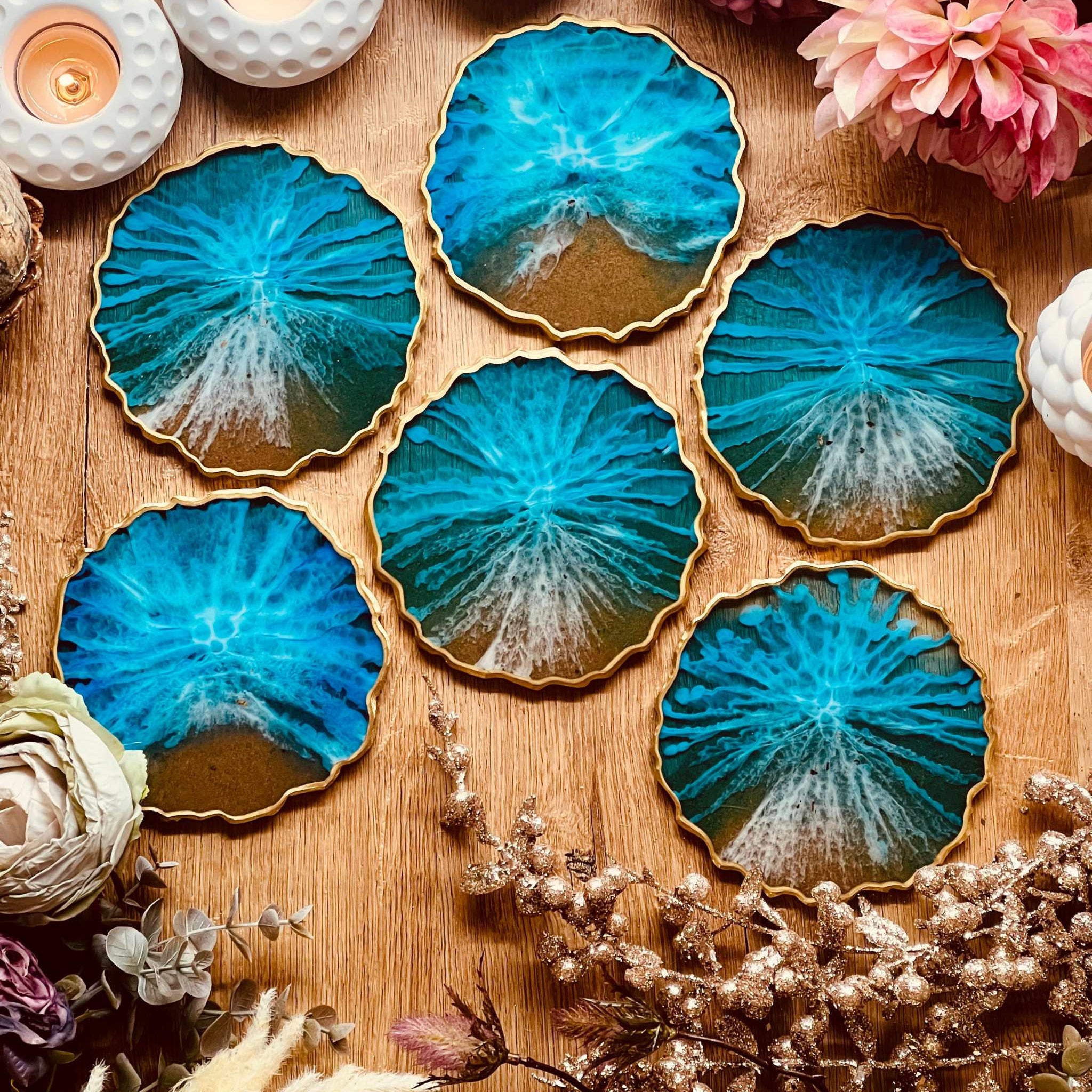 6 resin coasters in blue with gold in ocean design