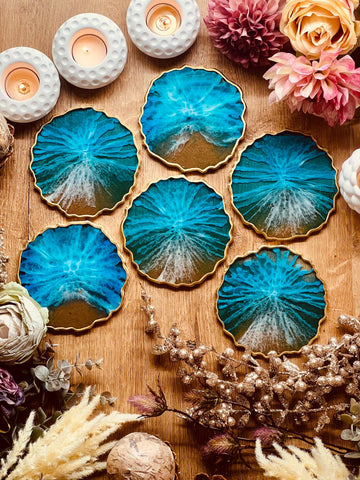 6 resin coasters in blue with gold in ocean design