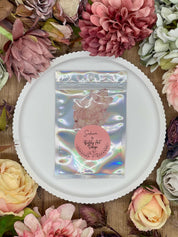 Twelve hand-pressed dried sakura cherry blossoms in pink for creative projects.