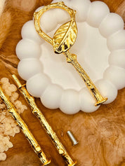 Etagerenstange “Leaf” in glänzendem Gold mit 11,5 cm Abschlusselement