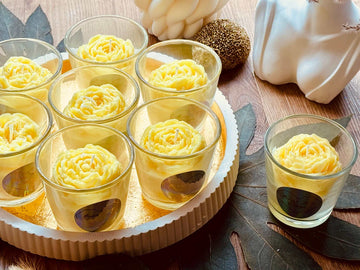 scented candle in glass with flower highlight