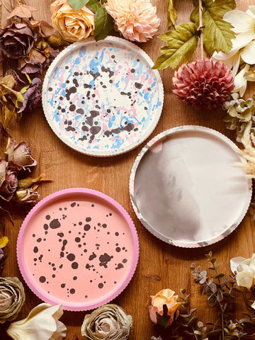 Cast ceramic trays in various colorful designs