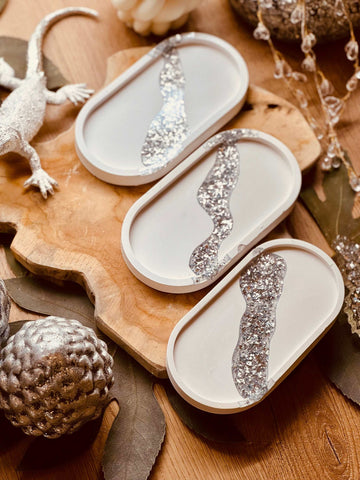Cast ceramic jewelry bowl with elegant silver leaf details
