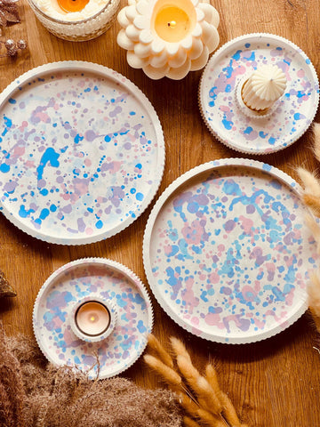Cast ceramic tray and candle holder in pastel-colored design