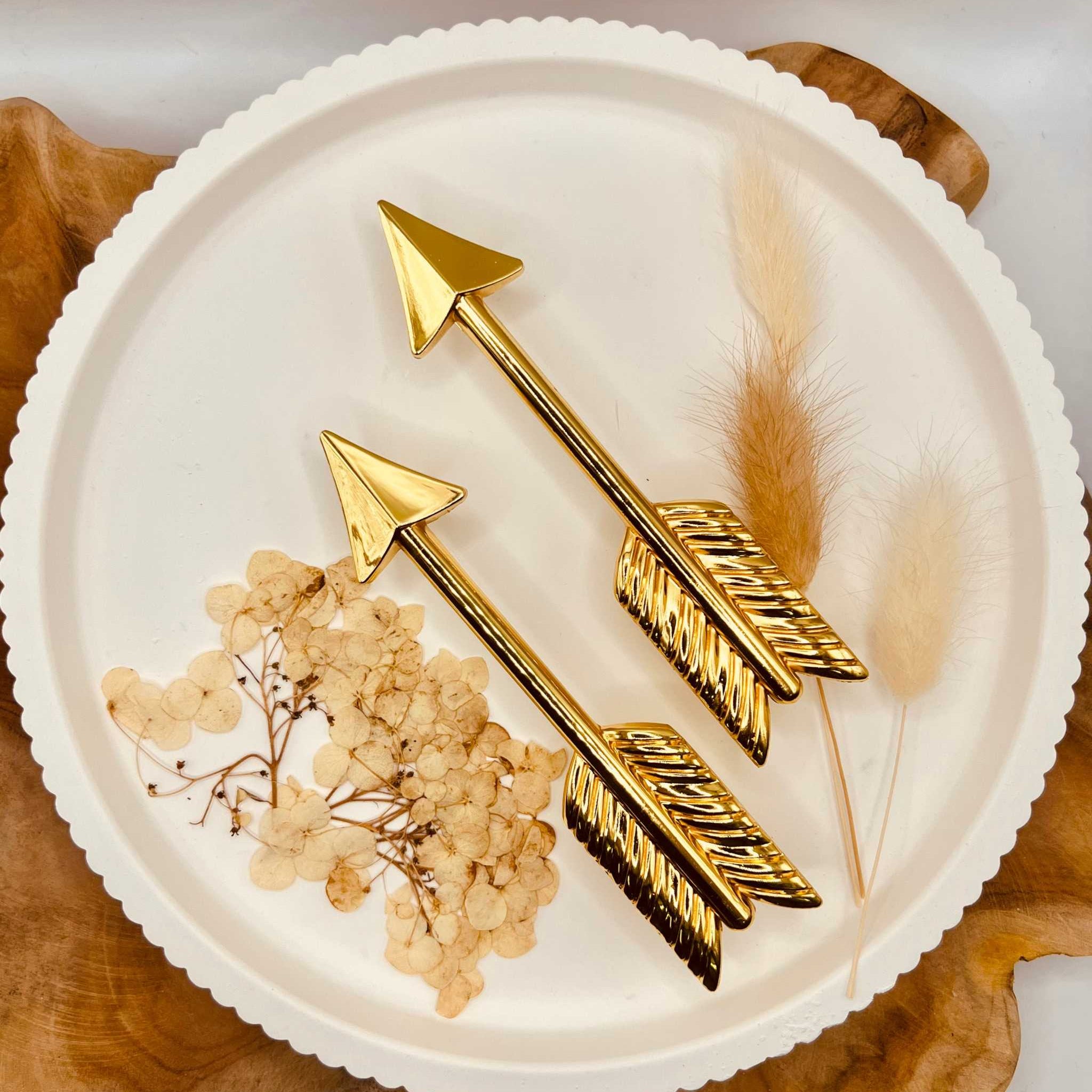 Gold-colored arrow-shaped tray handles set, perfect for DIY projects and resin art.