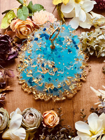 Resin cake stand with dried turquoise flowers and gold leaf