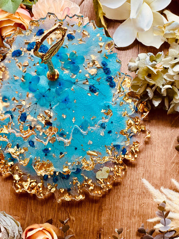 Resin cake stand with dried turquoise flowers and gold leaf
