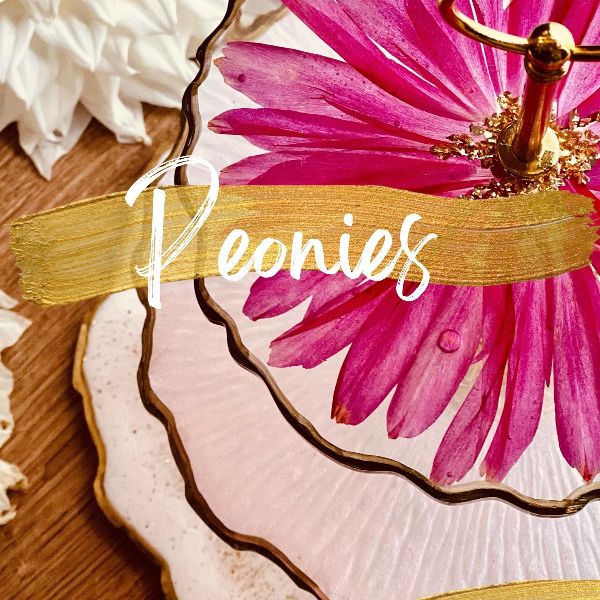 Close-up of pink flower art piece on textured ceramic background, highlighting Resin Art techniques.