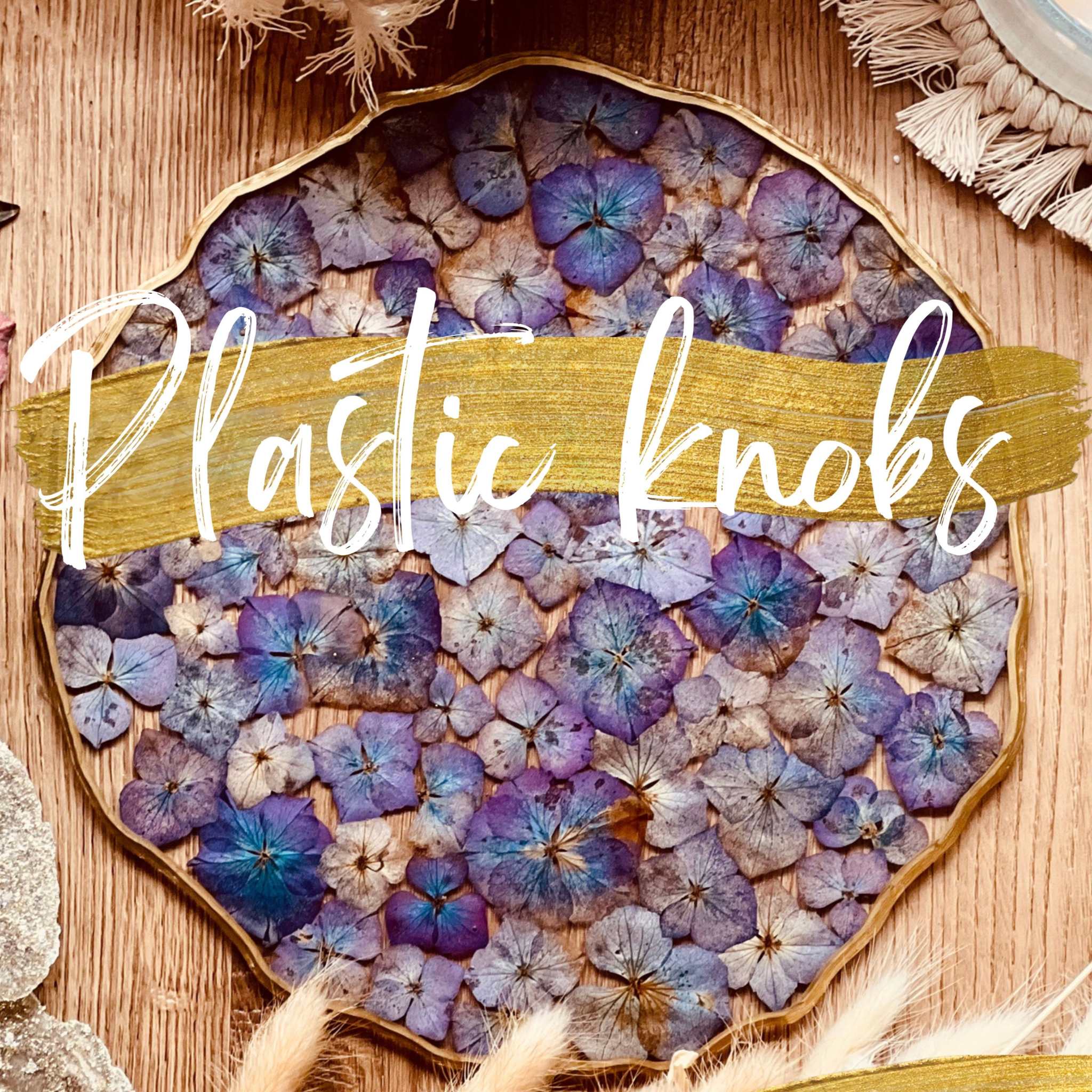 Resin art with purple and blue dried flowers on tray.