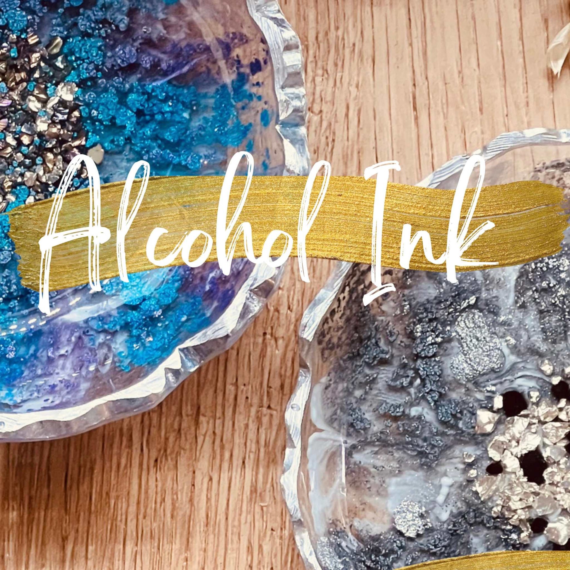 Resin art bowls with alcohol ink designs and metallic accents.