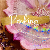 Resin art course packaging with vibrant pink and gold details.