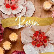 Resin art course featuring decorative plates with flowers, candles, and artistic designs.