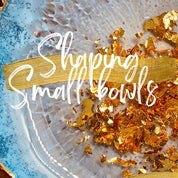 "Gold and blue resin art with text 'Shaping small bowls' showcasing resin art techniques."