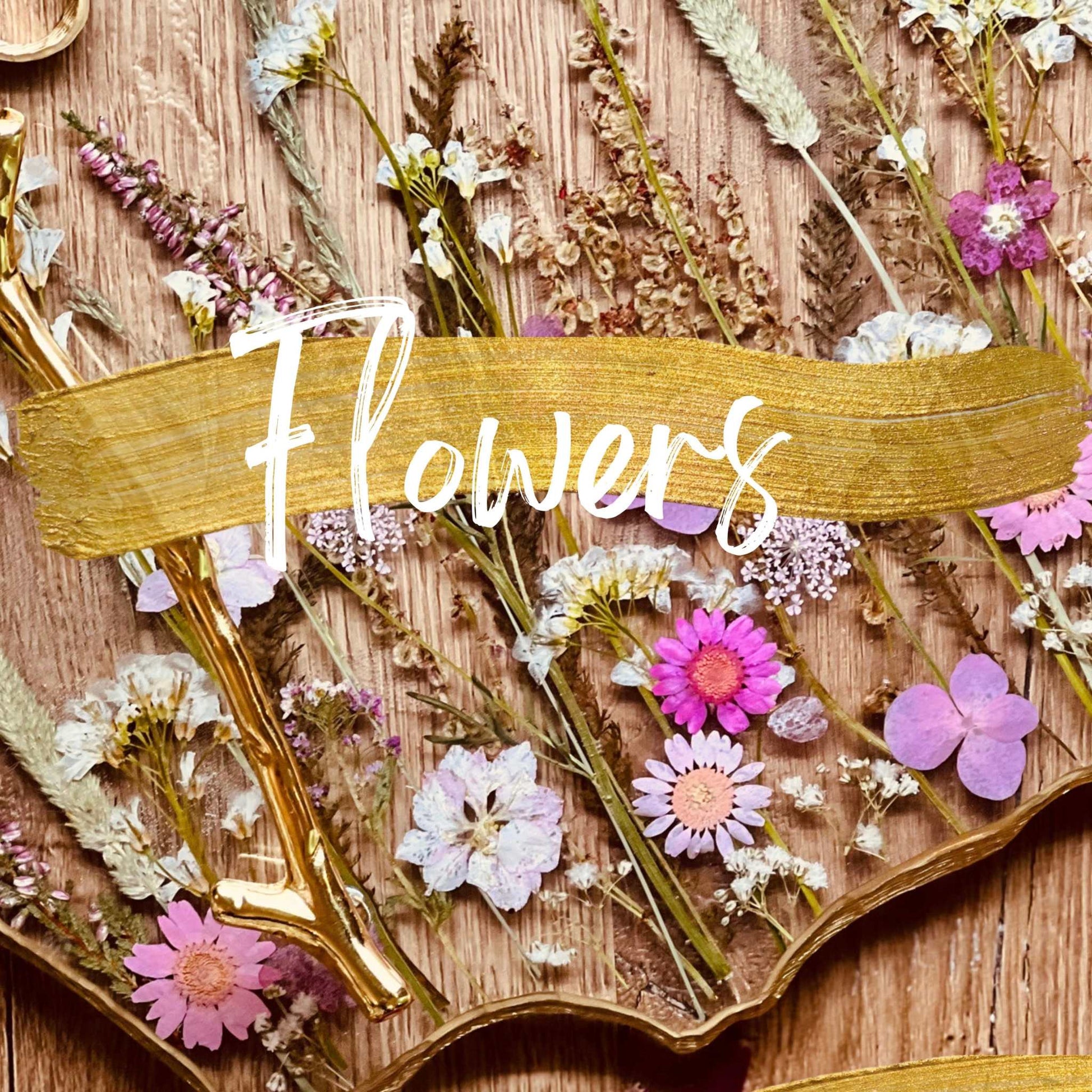 Resin art flowers on decorative wooden surface for online course.