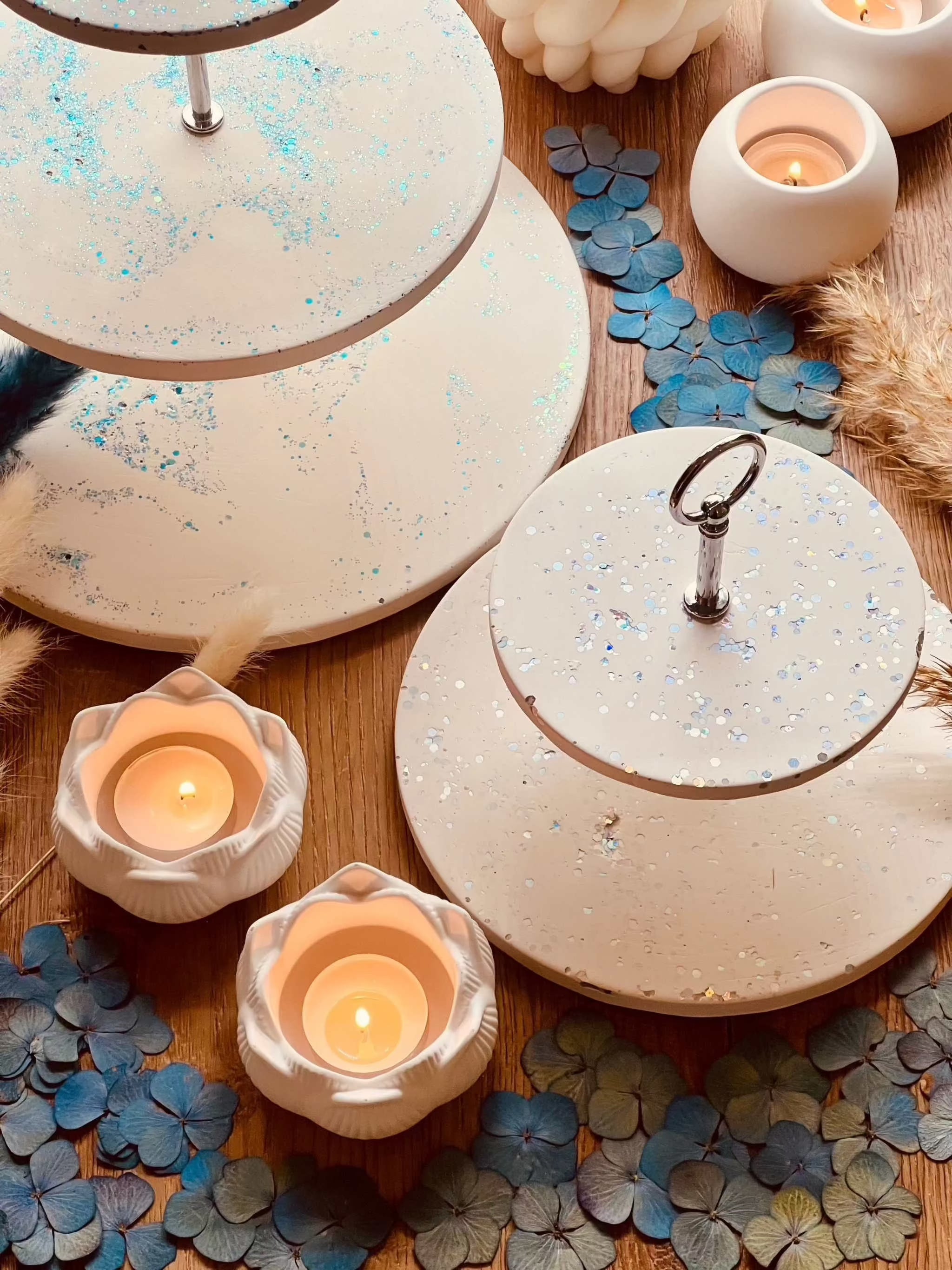 White hand-crafted ceramic tiered tray with glitter highlights, available in two sizes; ideal for elegant table decoration.