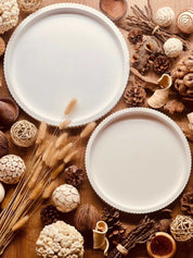 Handcrafted Gießkeramik trays with modern striped design surrounded by natural decor elements.Giesskeramik Weisse Deko Tablett geradlinig Straight Lines