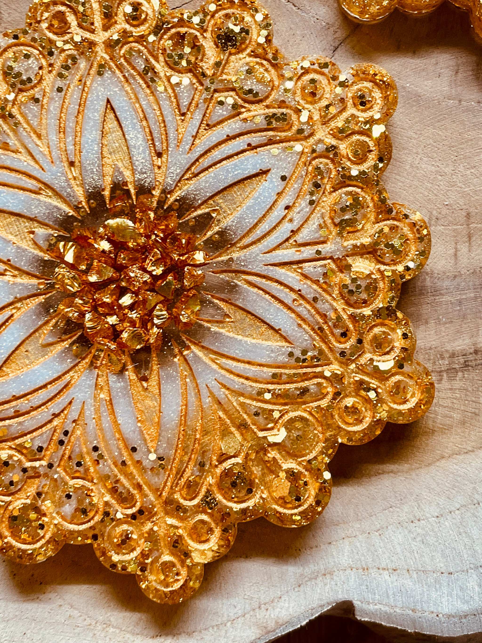 Handmade gold and white resin coasters for Christmas decor.