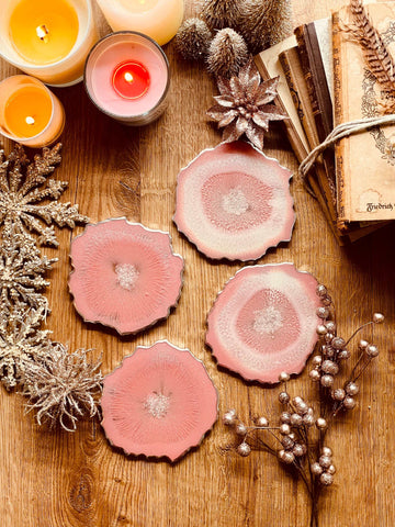 4 resin coasters in pink with silver