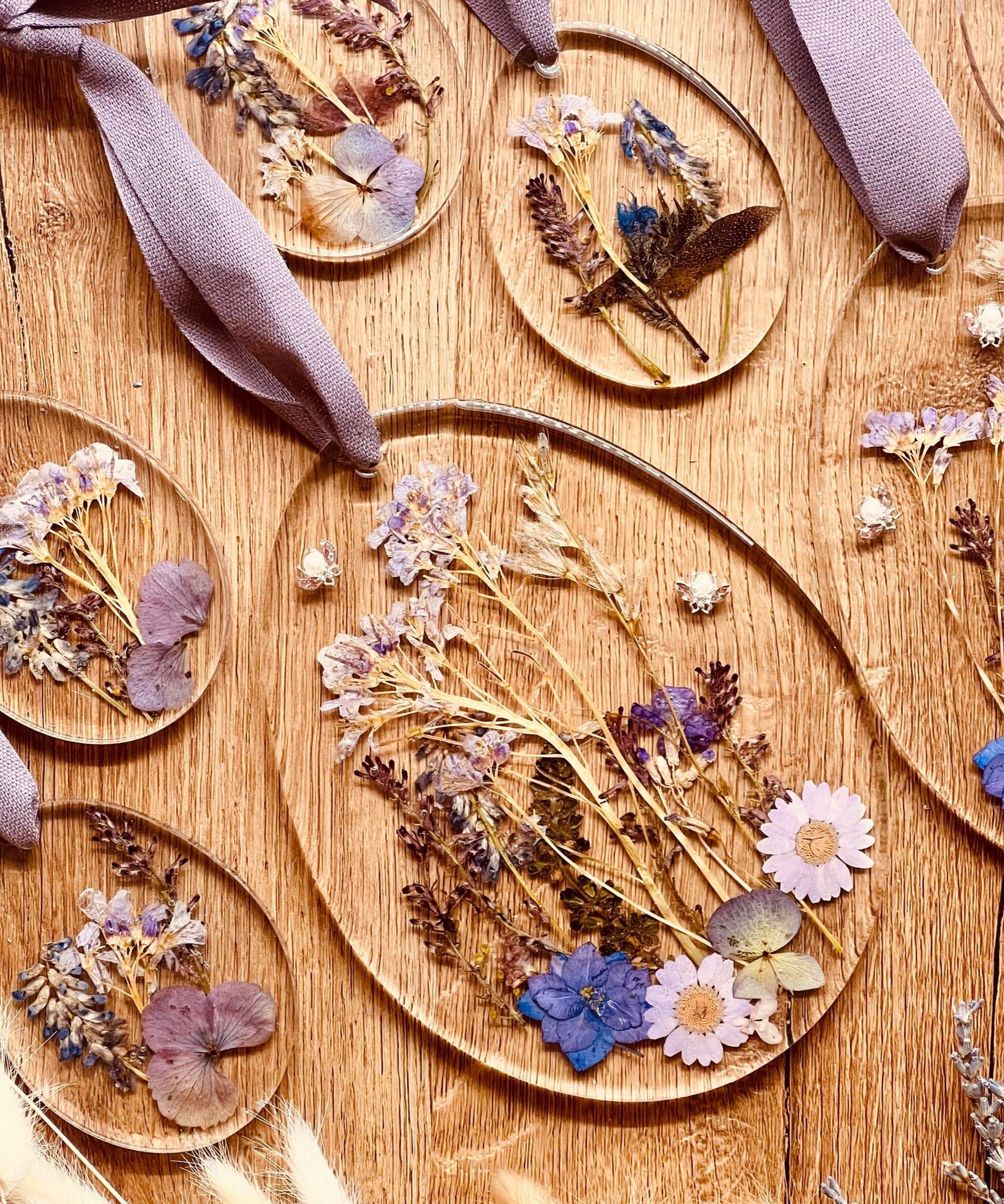 Handmade resin Easter egg ornaments with real dried plants, featuring 2 large and 8 small unique pieces.