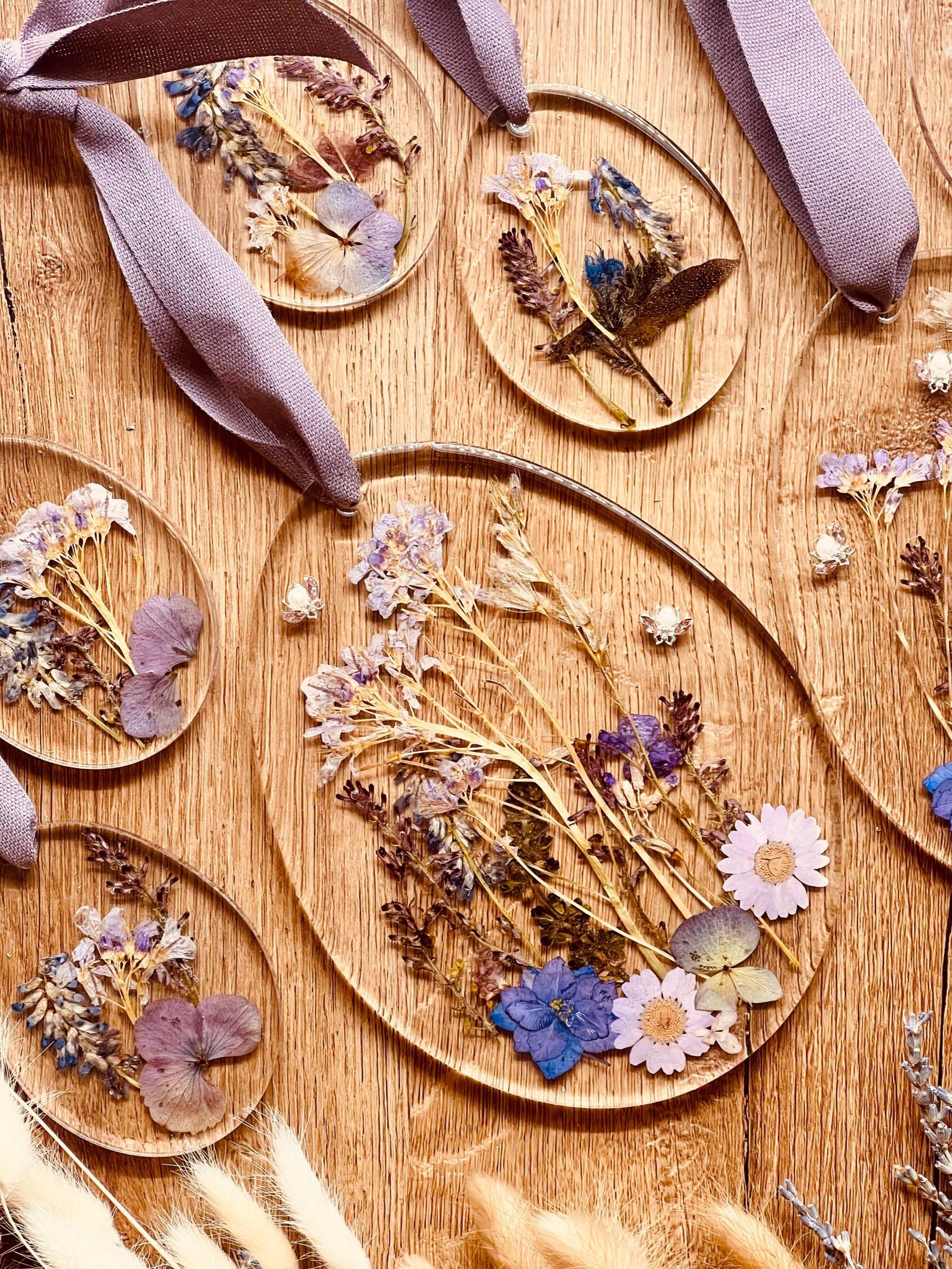 Handmade resin Easter egg ornaments with real dried plants, featuring 2 large and 8 small unique pieces.