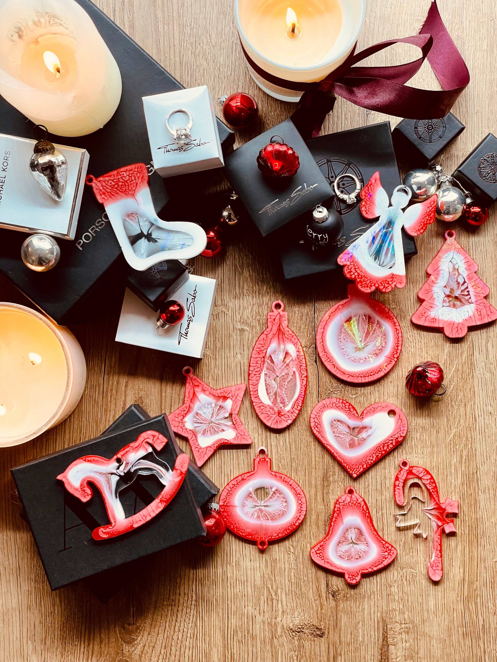 Red and white resin Christmas tree ornaments with holographic surface in a 10-piece handmade set.