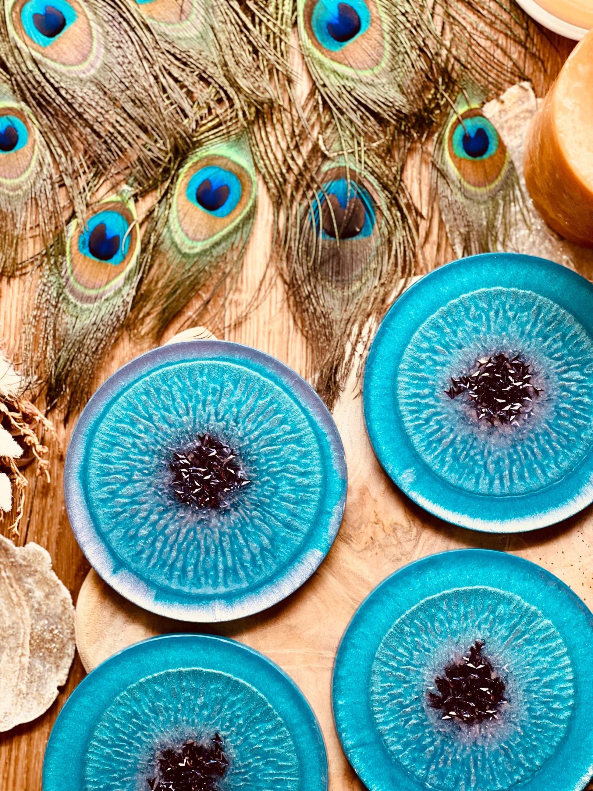 Handmade turquoise and purple resin coasters set of 6 on a wooden table.