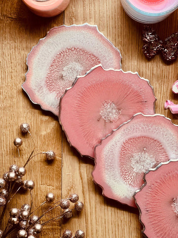 4 resin coasters in pink with silver