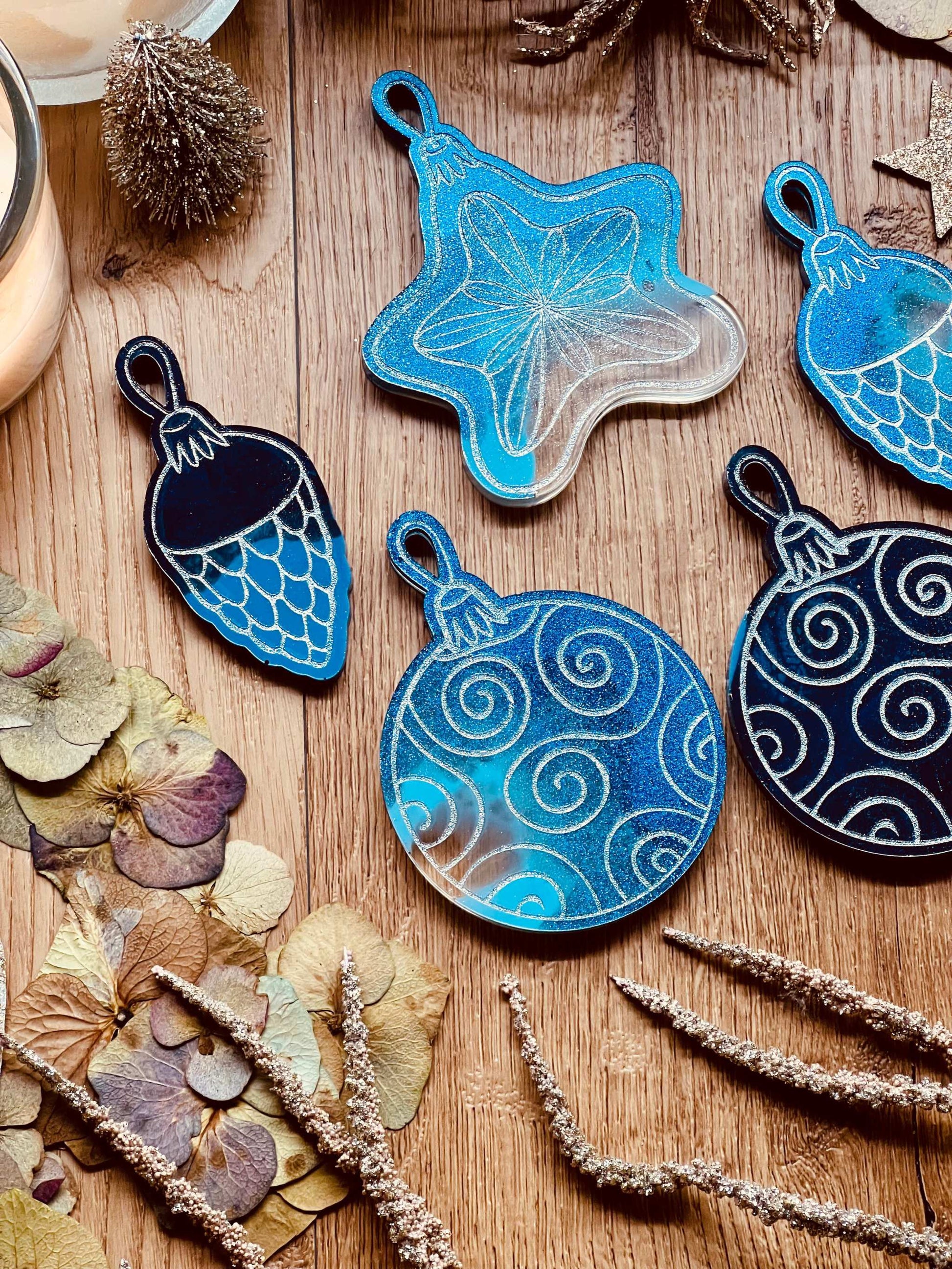 Handmade blue resin Christmas tree ornaments with silver accents, set of five.