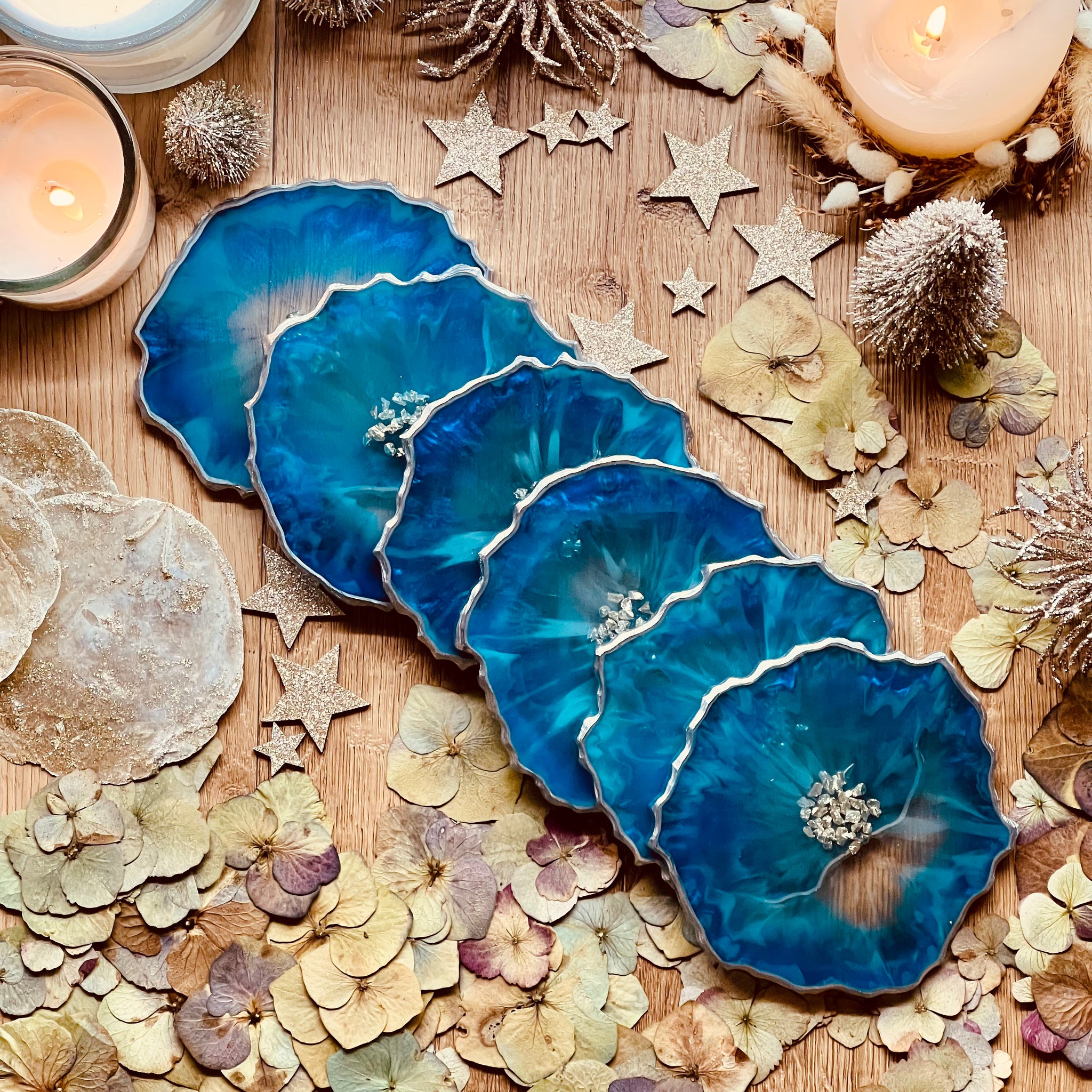 6 resin coasters in blue with silver