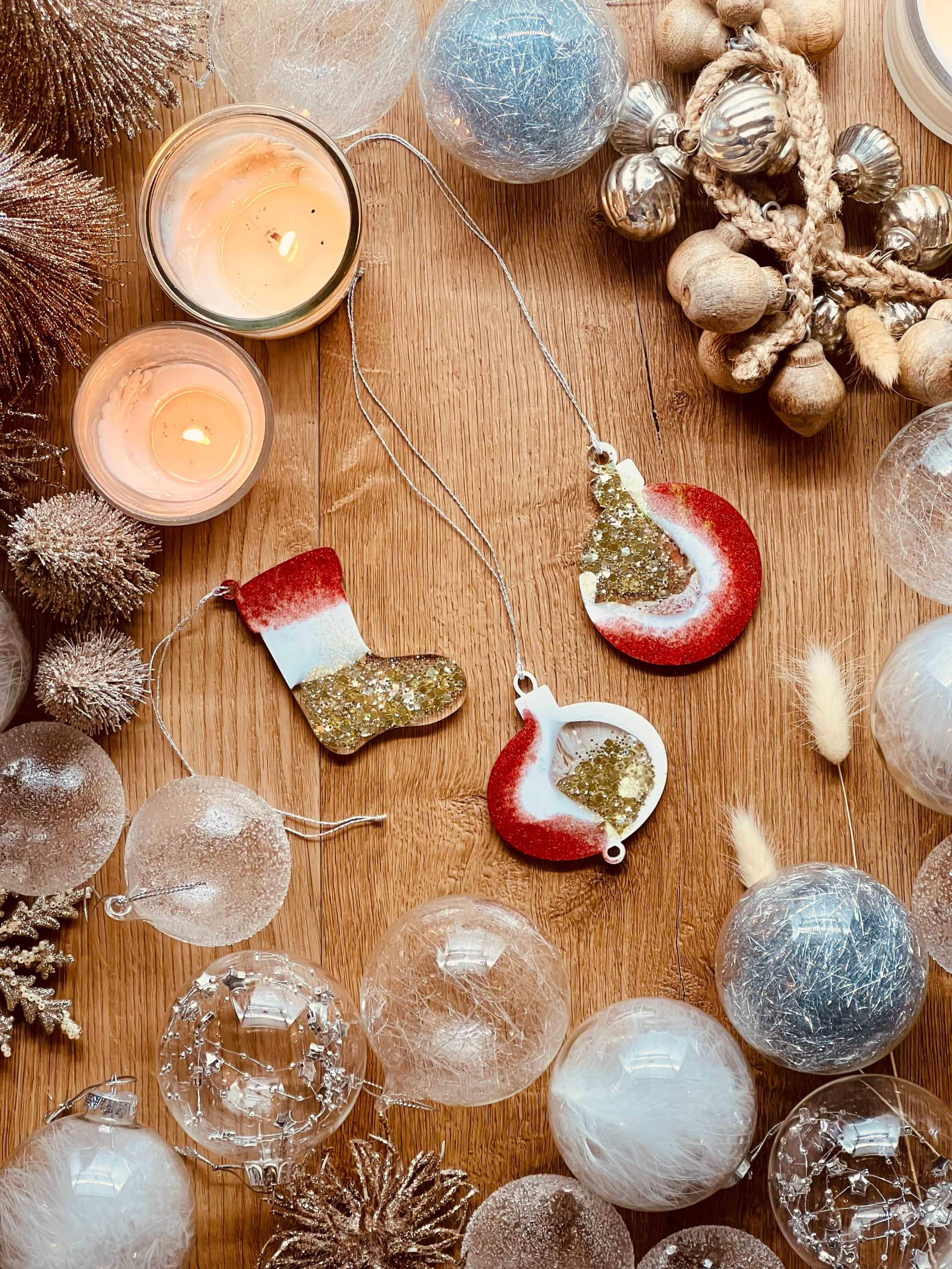 Handmade resin Christmas tree ornaments in red, gold, and white with holographic surface, set of three.