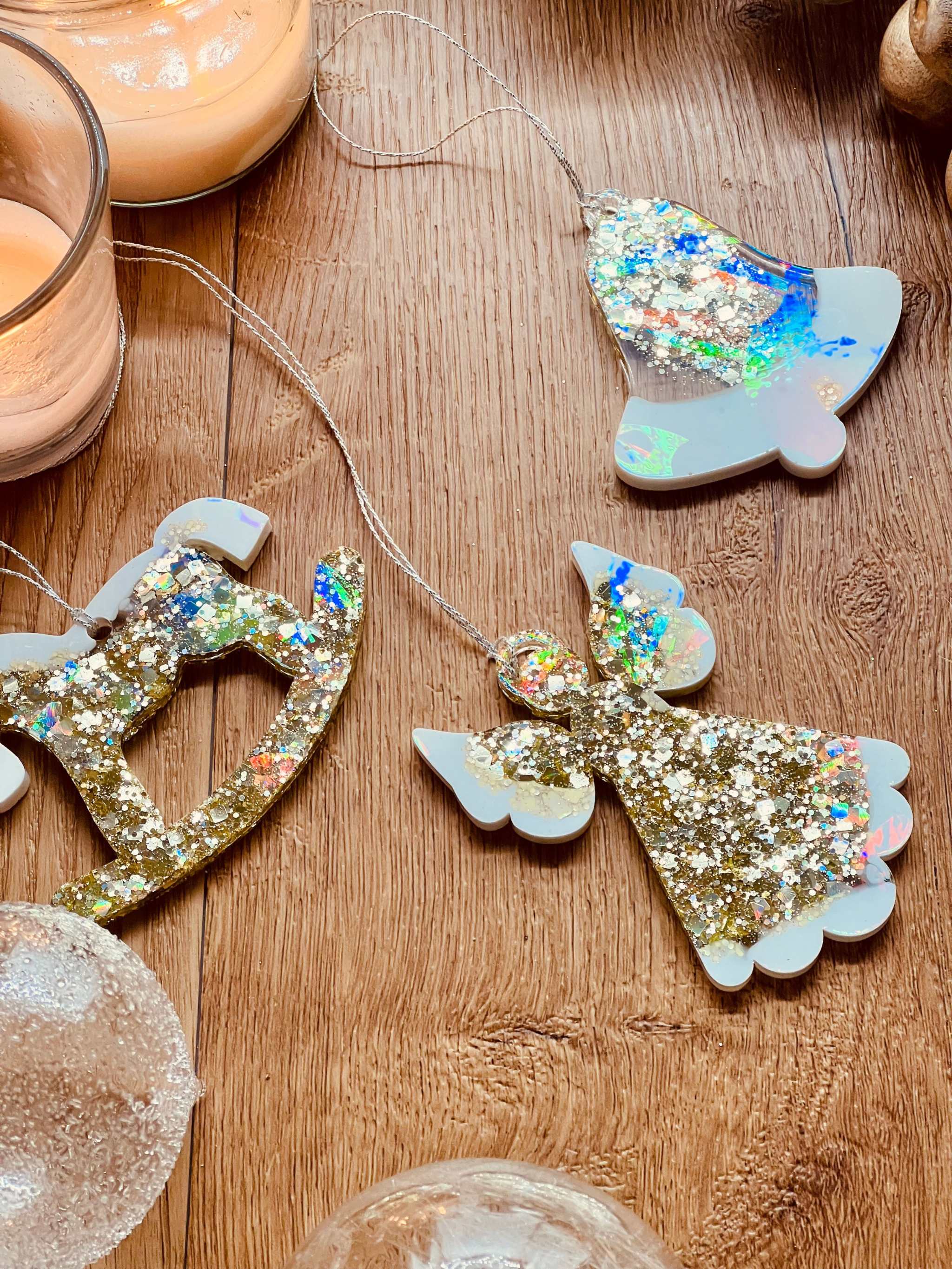 Handmade resin Christmas tree ornaments in gold and white with holographic surface, set of three.