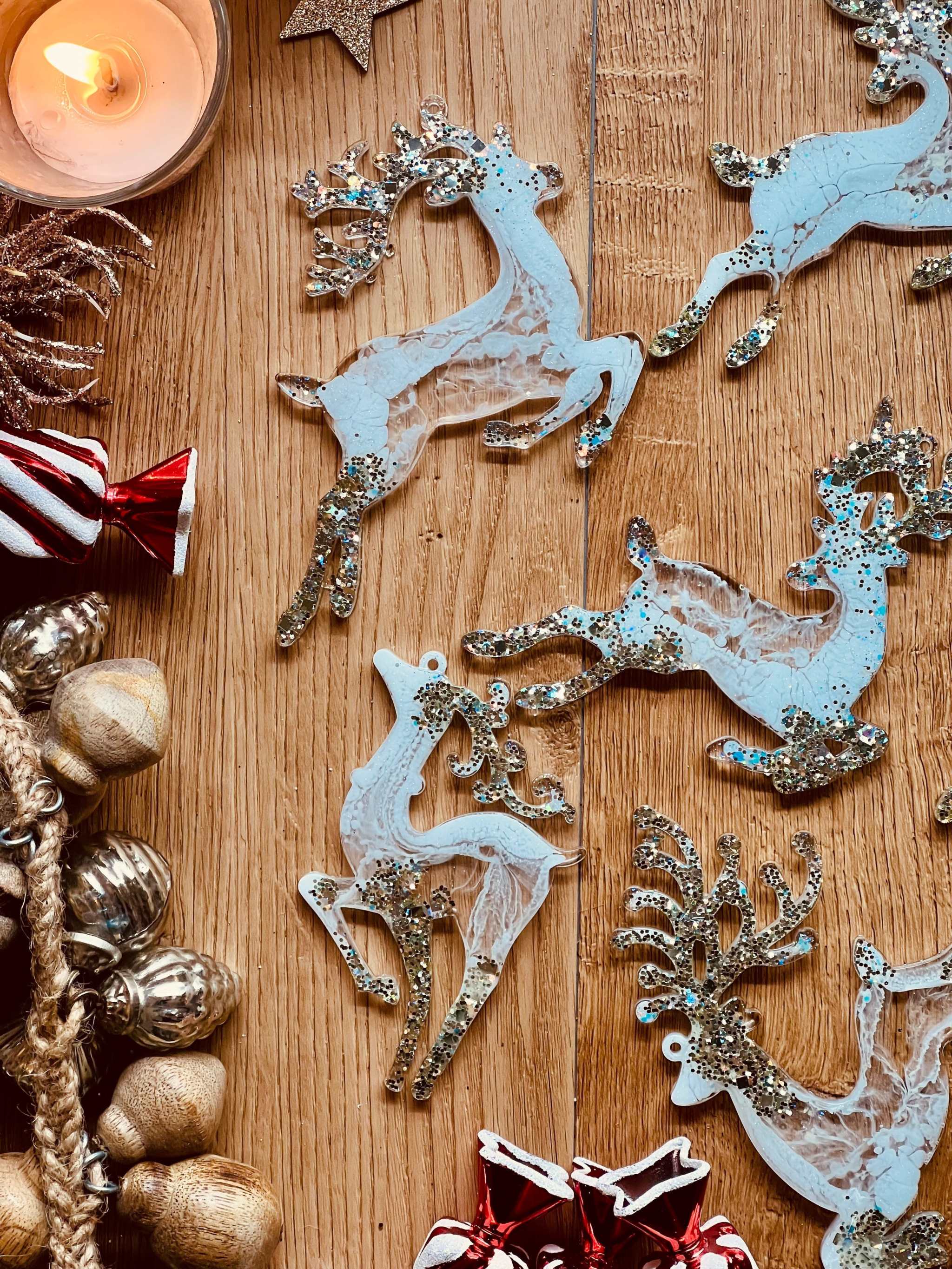 Handmade white and silver resin reindeer Christmas tree ornaments.