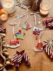 Handmade resin Christmas tree ornaments in red and white with holographic surface, 5-piece set.