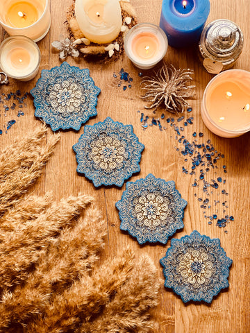 4 mandala resin coasters in blue with gold